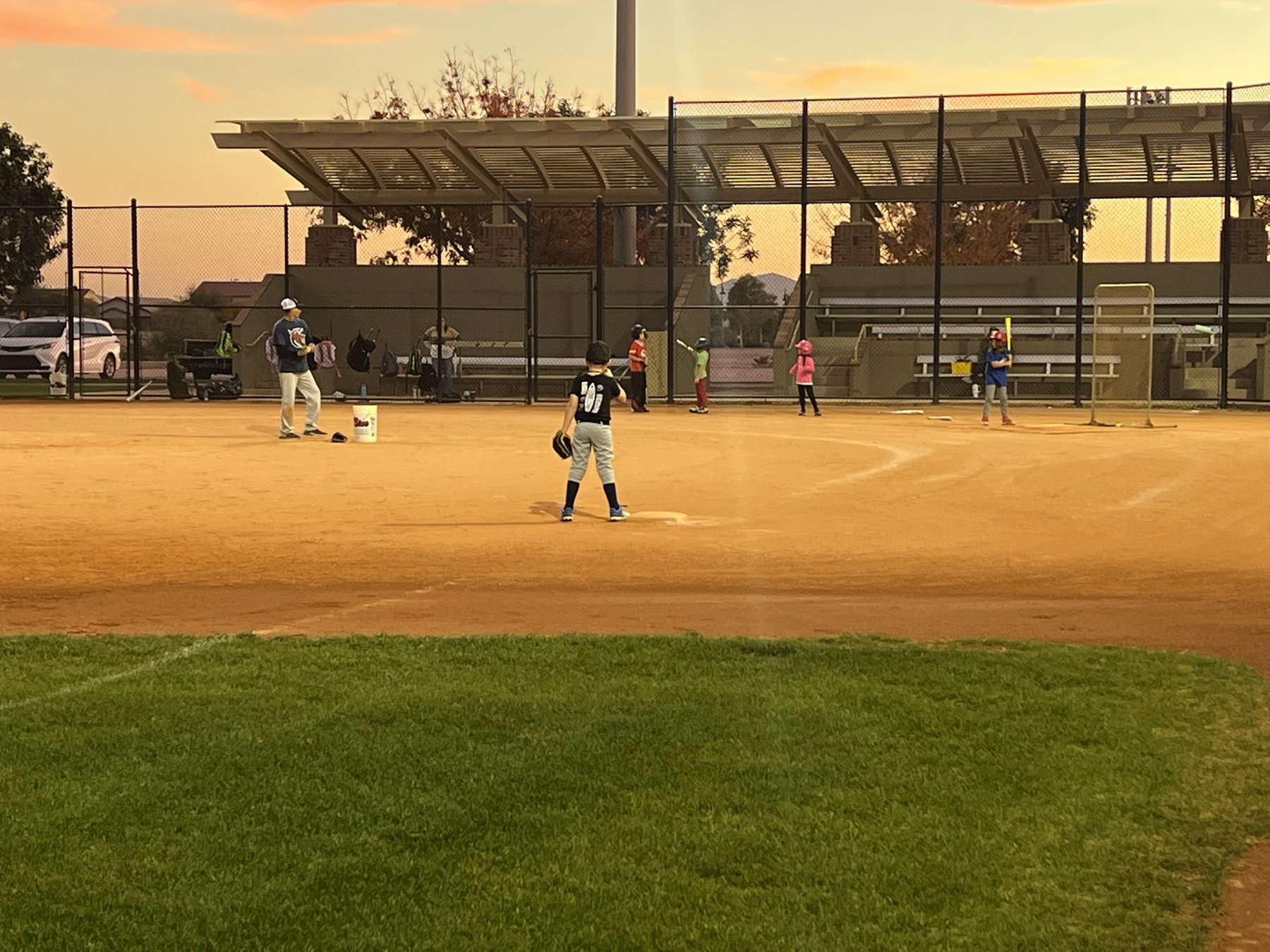 Youth baseball clinic at sunset