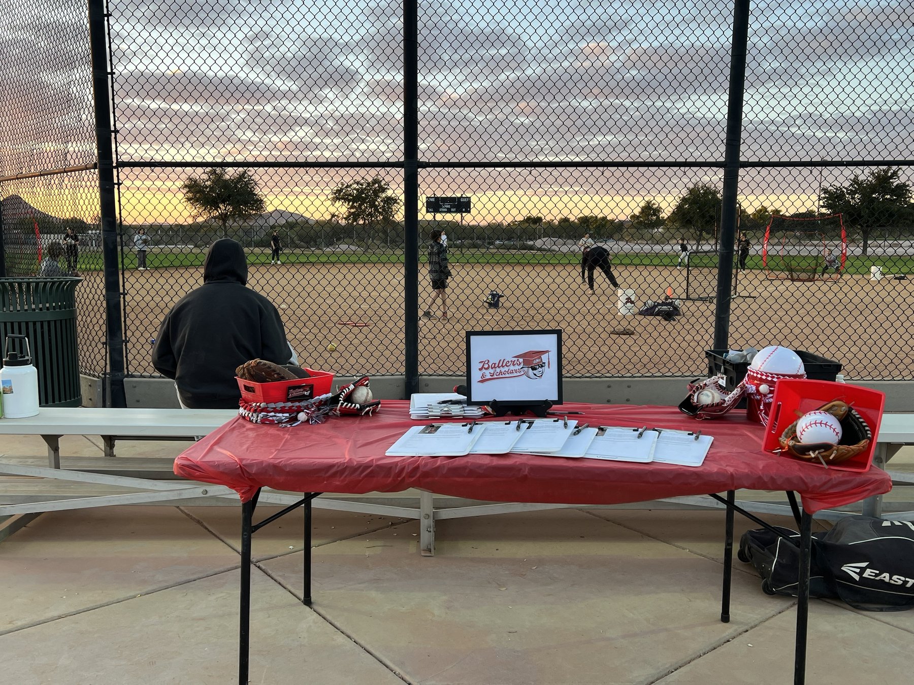 Ballers & Scholars sign-up table at a youth baseball clinic